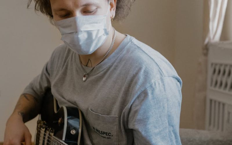 A focused man's face during a workout session.